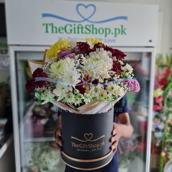 Rainbow of Joy : A round flower box with a mix of colorful chrysanthemums and baby’s breath