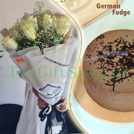 Sweet Romance: A gift package consisting of a bouquet of white roses and baby’s breath wrapped in white paper with a blue ribbon and a red card, and a round German fudge cake with chocolate shavings on top, on a white background with the text “TheGiftShop.pk” in blue cursive on the top left corner.