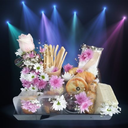 “Assorted gourmet snacks and fresh chrysanthemums elegantly arranged on a tray, embodying the ‘Bloom & Bite Ensemble’ from TheGiftShop.pk.”