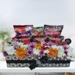 Nimco Blossom Tray: Savory snacks and fresh Chrysanthemum flowers arranged in a decorative tray