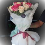 Harmony in Bloom: A bouquet of 5 long-stem pink and 5 long-stem white roses, elegantly wrapped, symbolizing unity and grace