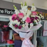 Cheerful Mix Bouquet: Pink roses, white gladiolus, multicolored chrysanthemums, baby's breath.